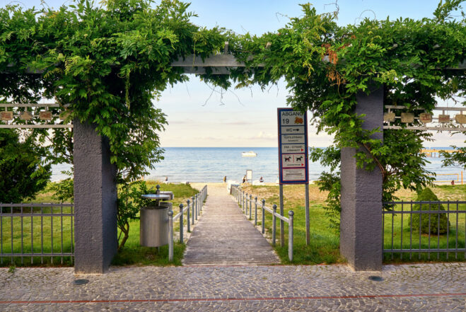 Binz, Germany - August 23, 2017: Pergola climbing plants on the way to the beach. Binz on the island of Rügen on the Baltic Sea. Mecklenburg-Vorpommern, Germany